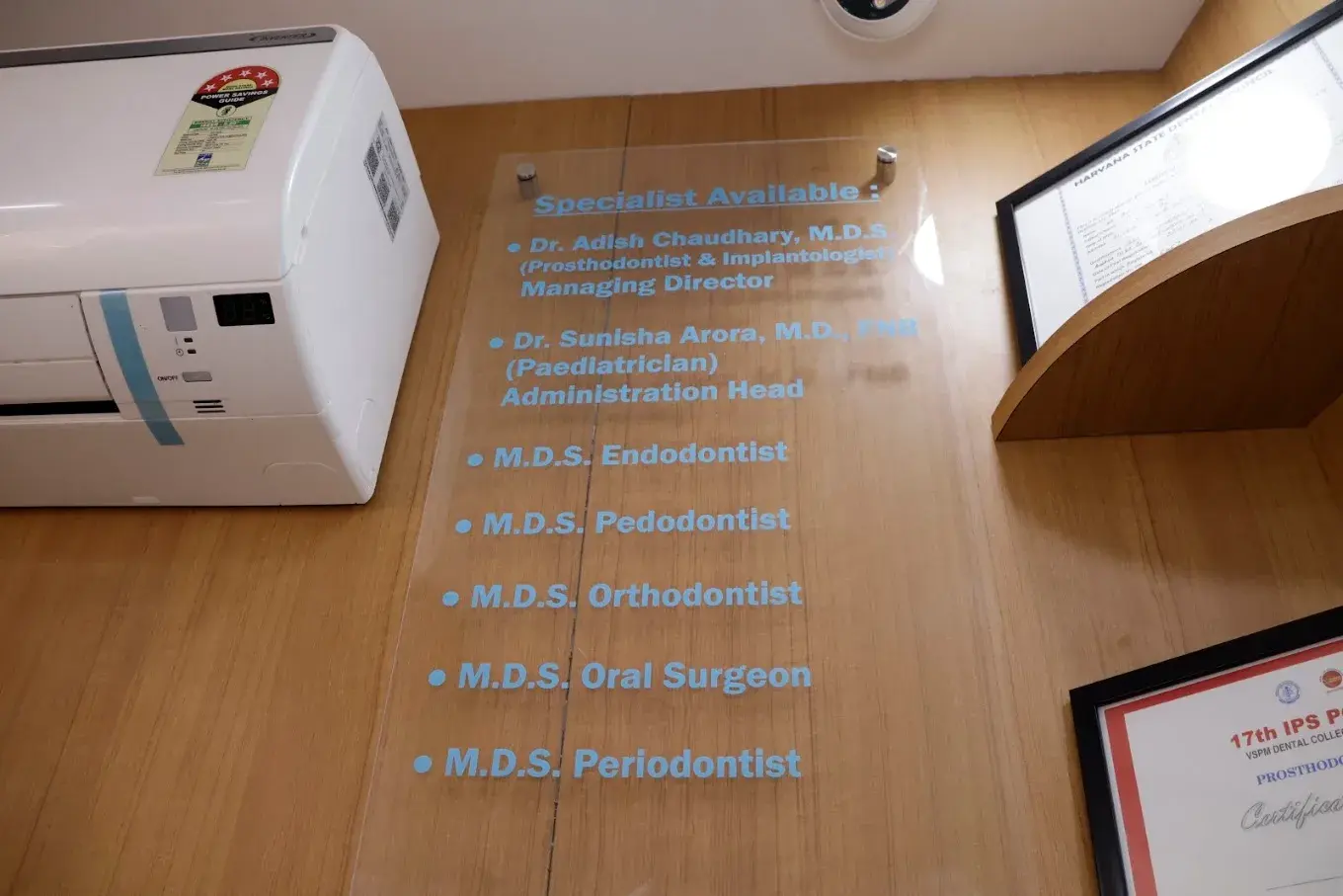 Specialist information displayed on a wall at Petal Smiles